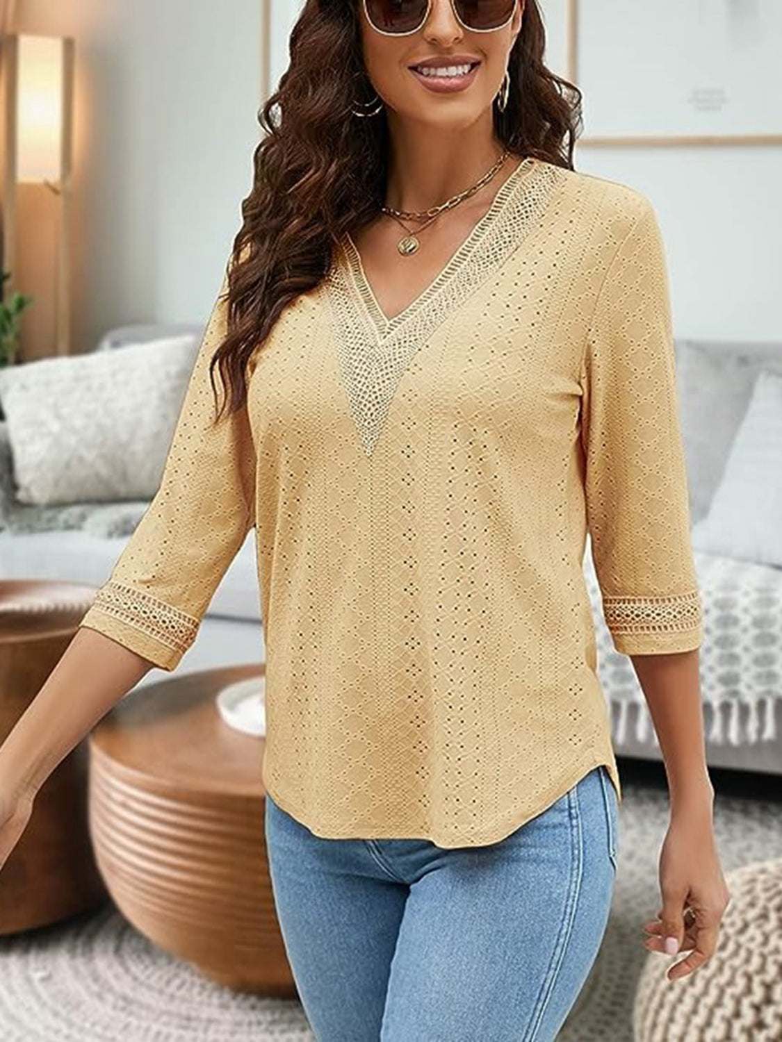 V-Neck Eyelet Blouse in yellow with three-quarter sleeves, worn by a woman in a casual setting.