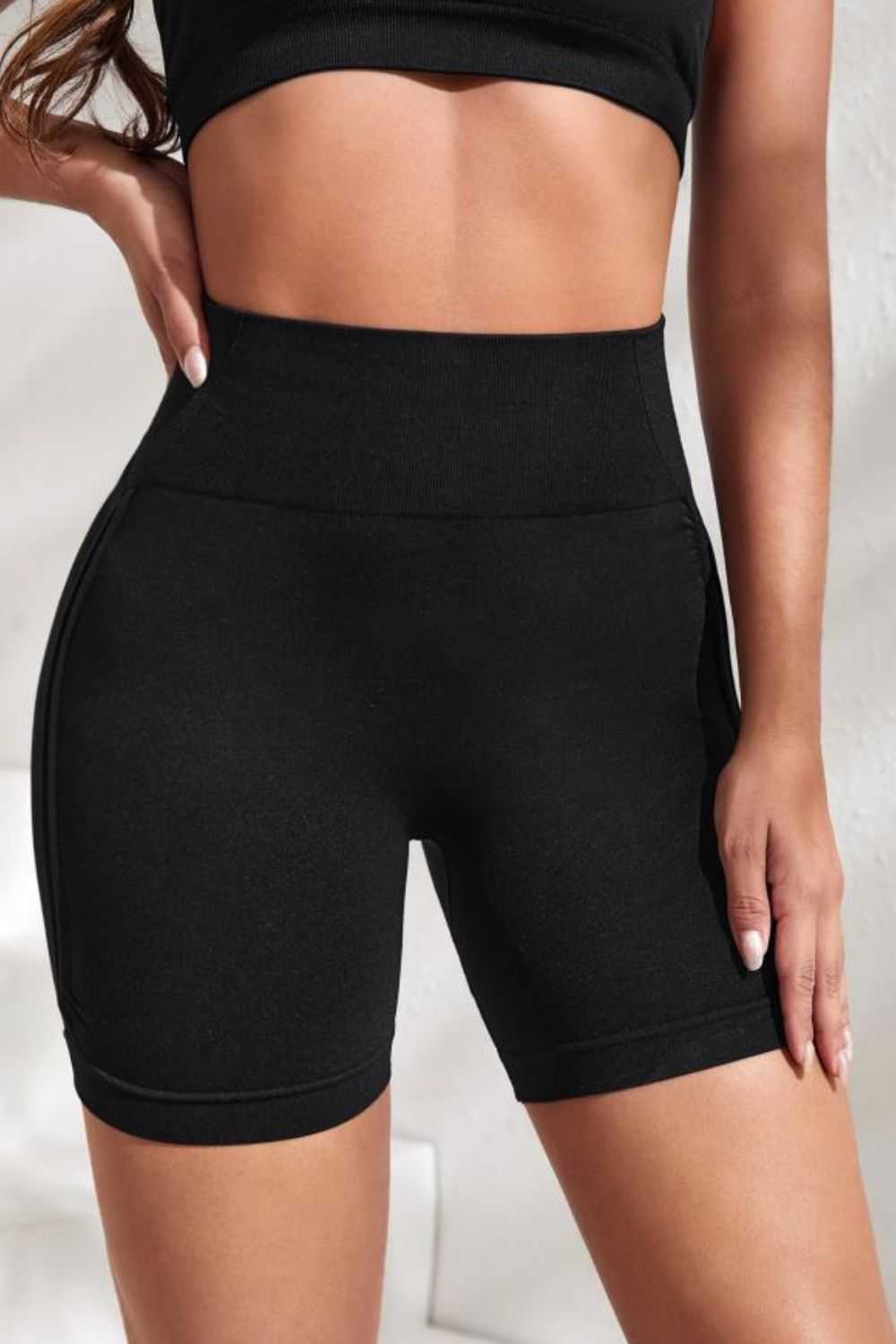 Slim fit high waistband active shorts, black, sporty style.