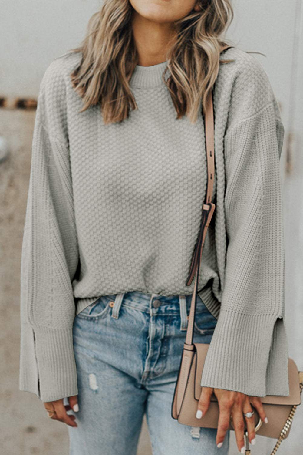 Textured round neck long sleeve sweater with slits, slightly stretchy and casual style.