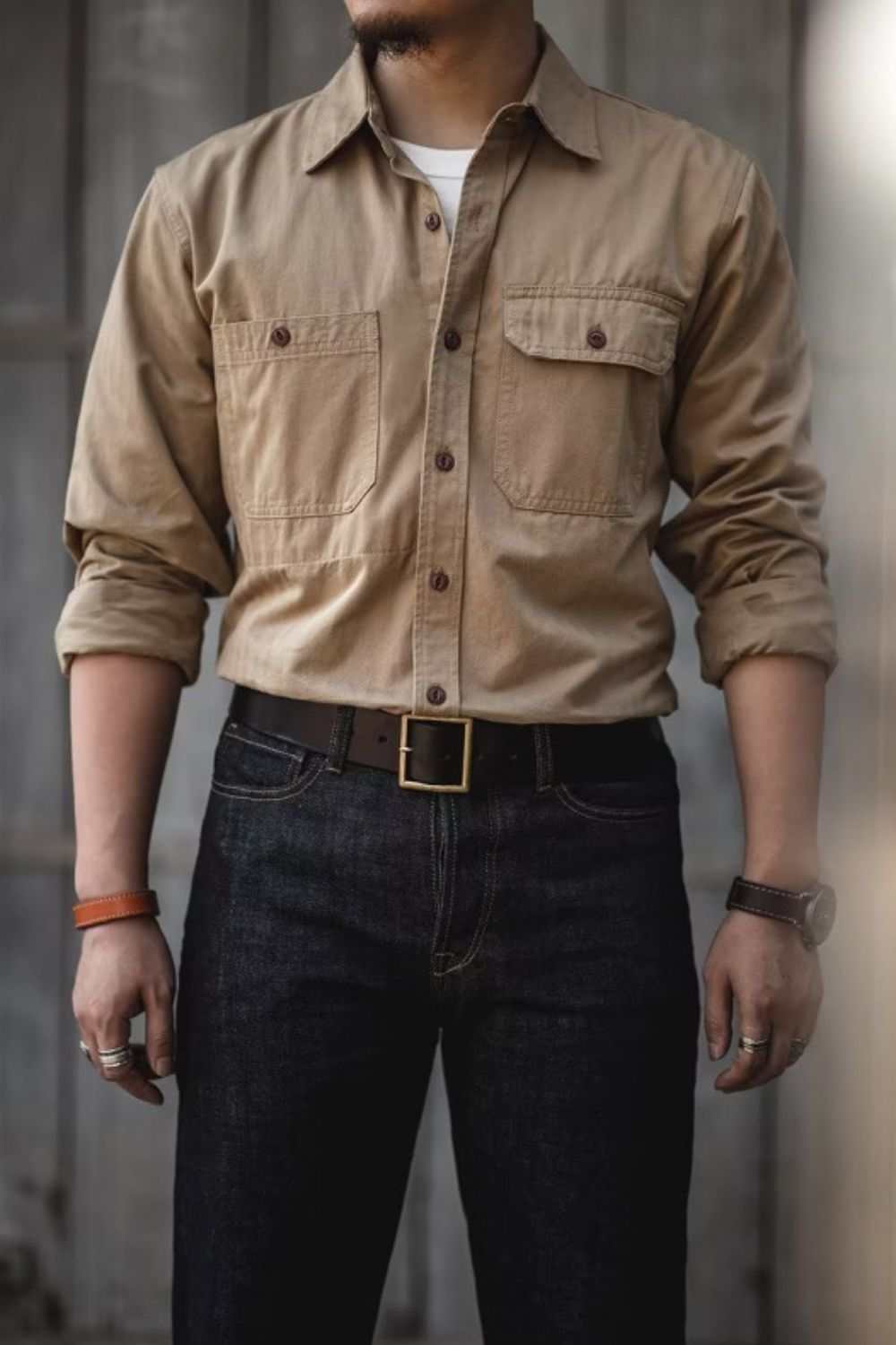 Men's button down long sleeve shirt with chest pockets, casual fit, slightly stretchy, cotton-polyester blend.