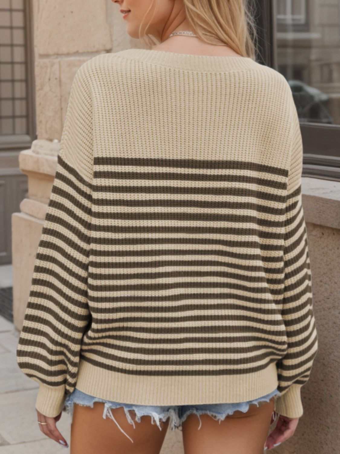 Striped round neck long sleeve sweater in beige and black tones, showcasing moderate stretch and acrylic material.