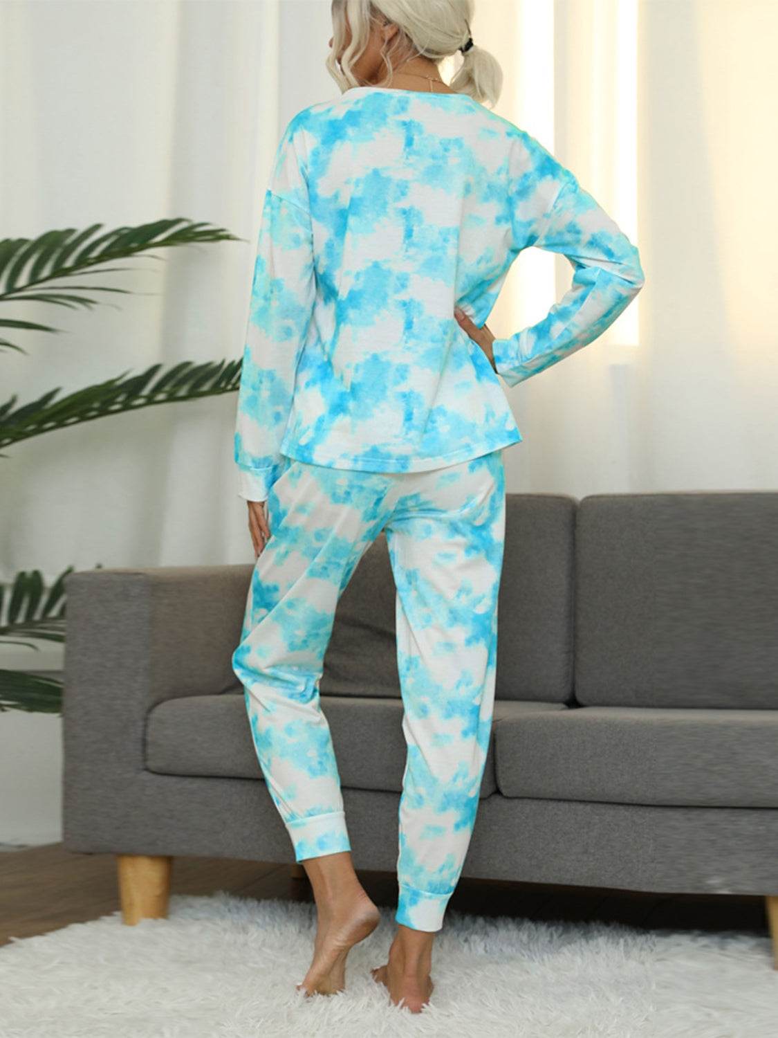 Shiny tie-dye round neck top and pants lounge set in blue and white tones, back view.
