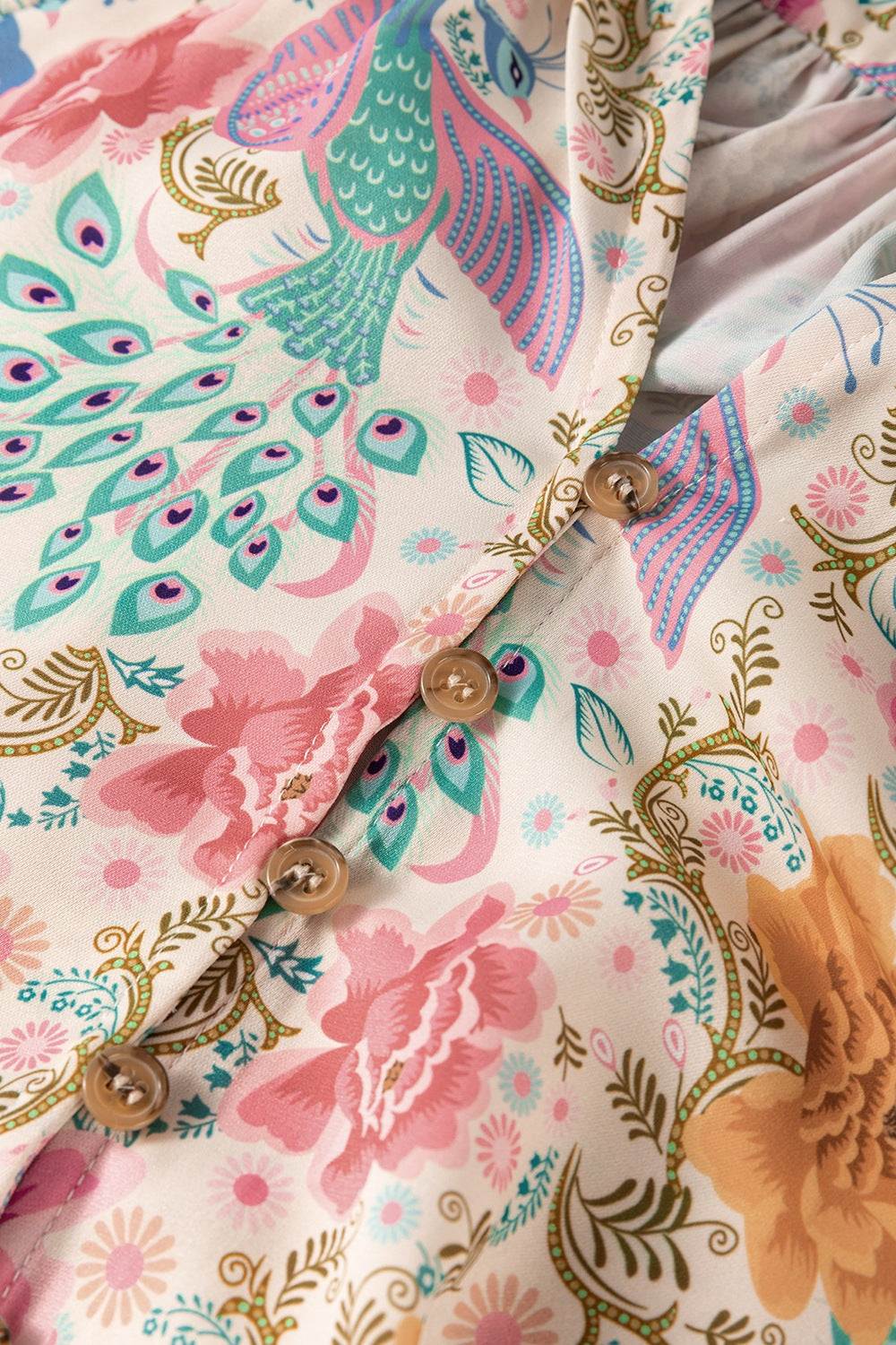 Printed notched lantern sleeve dress with button details and floral design.