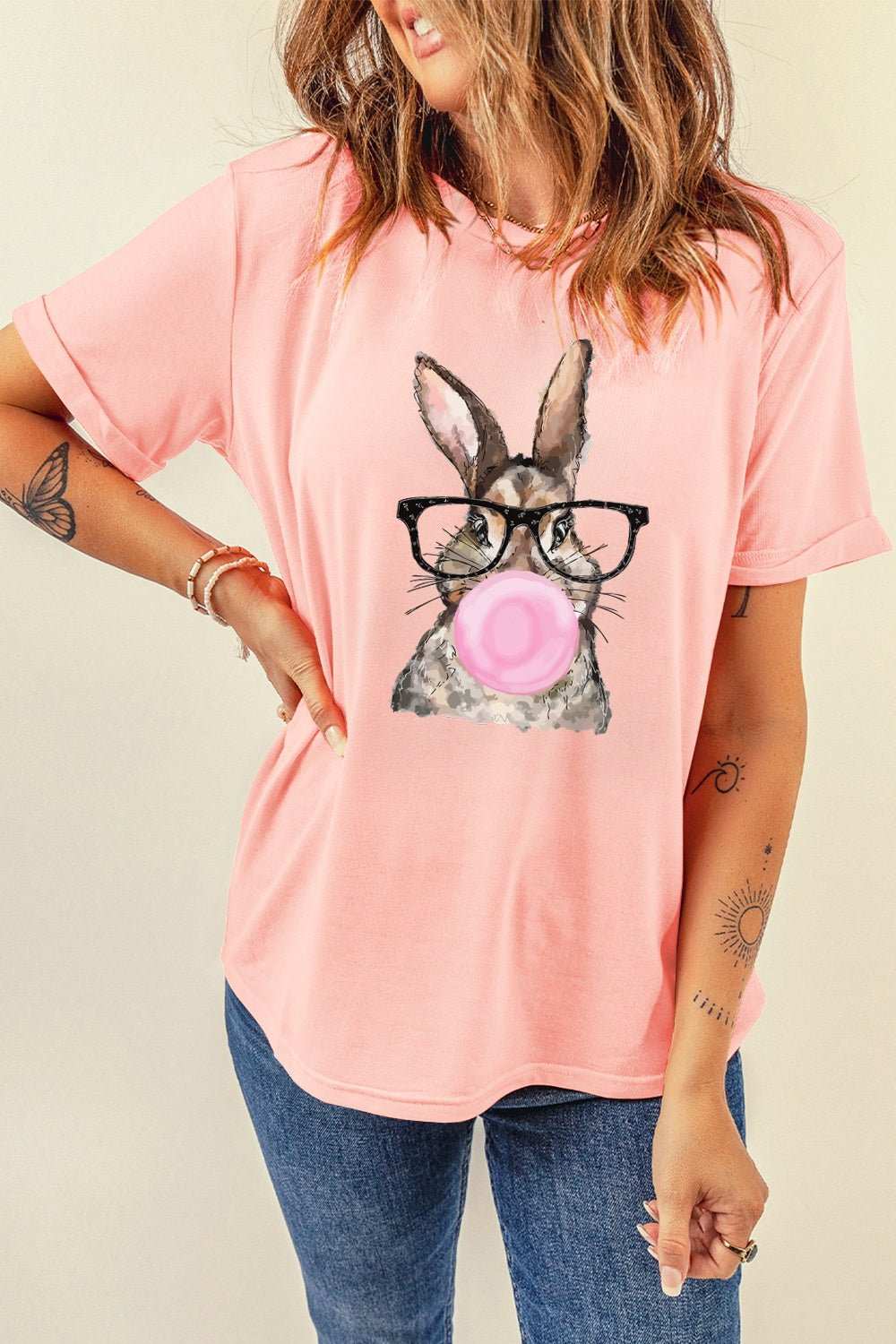 Rabbit round neck short sleeve t-shirt in pink with a cute rabbit graphic wearing glasses and blowing a bubblegum.