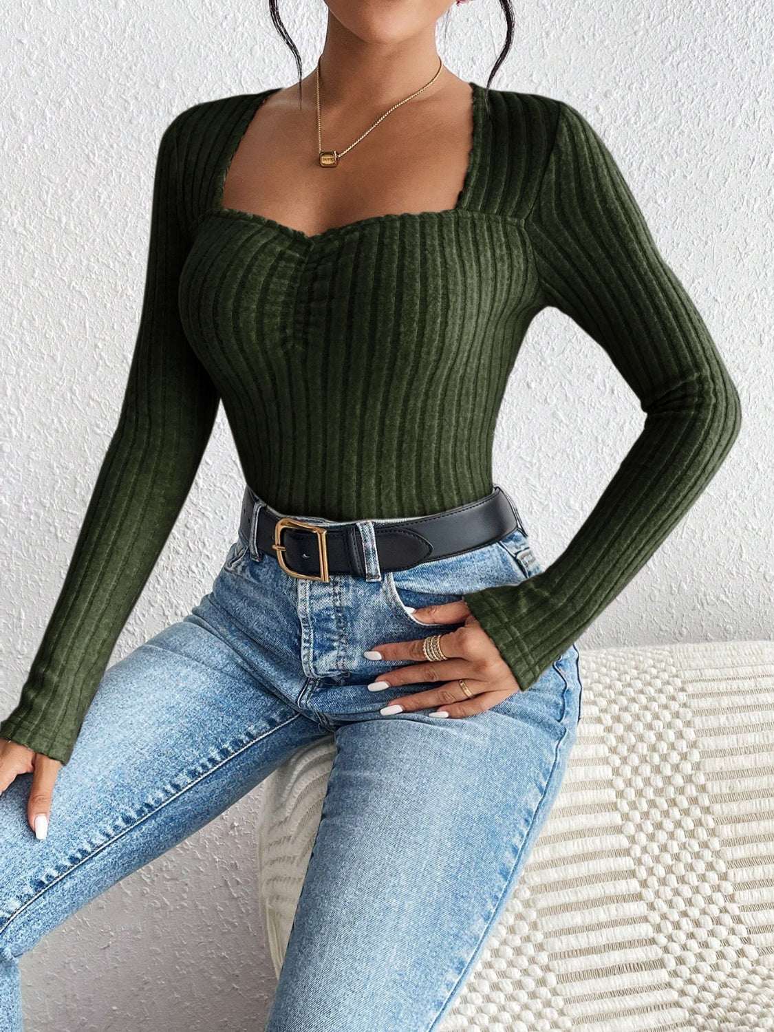 Honey ribbed long sleeve t-shirt with a basic style in dark green, slightly stretchy polyester blend material.
