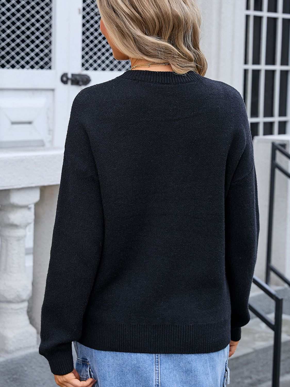 Back view of Angel Wings Bow Graphic Round Neck Long Sleeve Sweater in black.