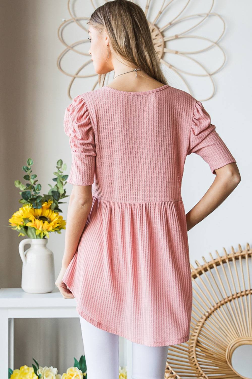 Heimish Full Size Waffle Knit V-Neck Babydoll Top in pink, back view, showing waffle knit texture and short sleeves.