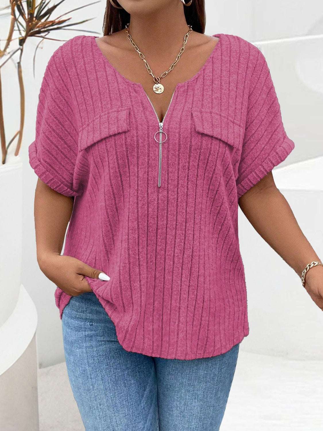 Plus size half zip short sleeve pink T-shirt with ribbed texture.