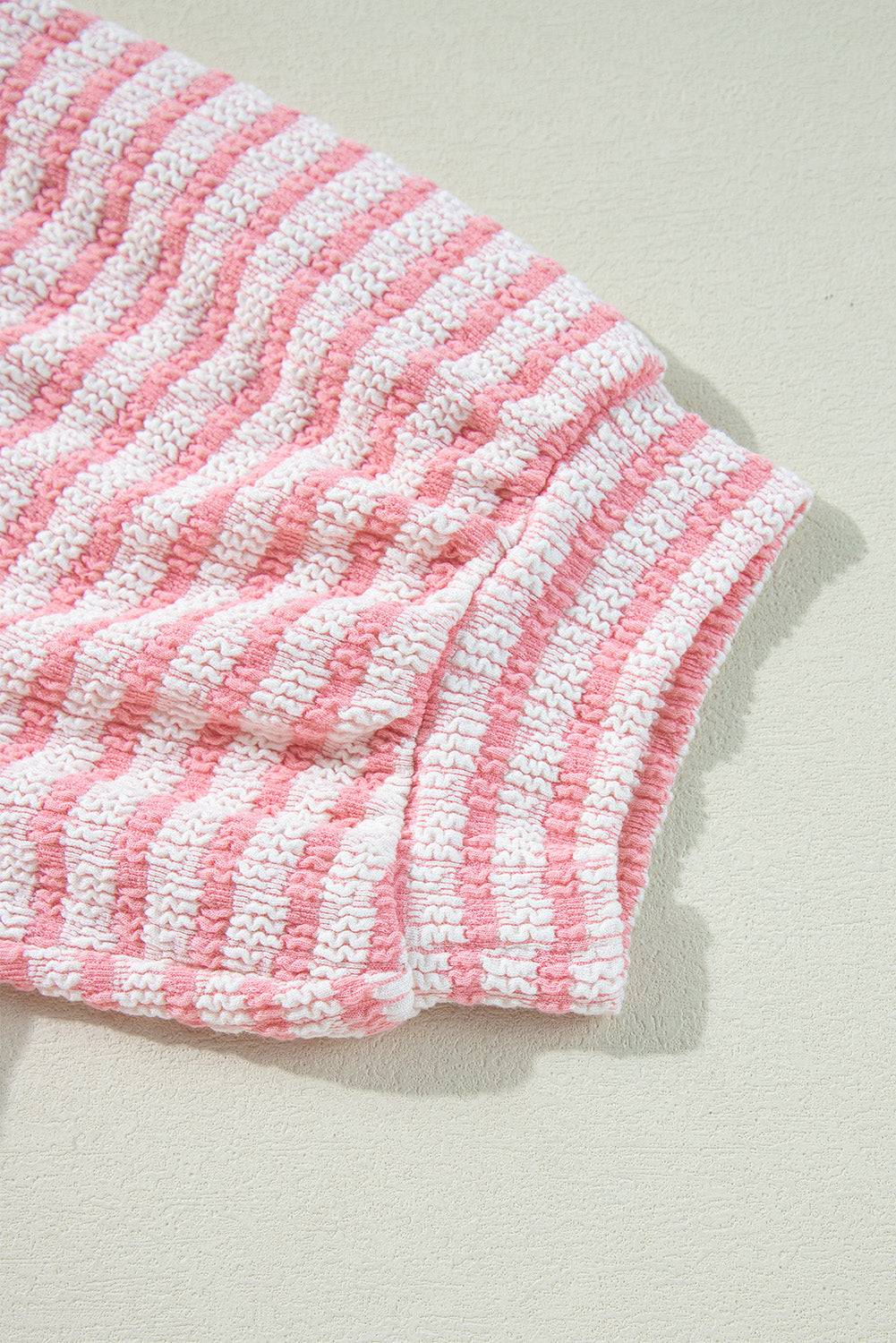 Stripe textured puff sleeve blouse with pink and white pattern.