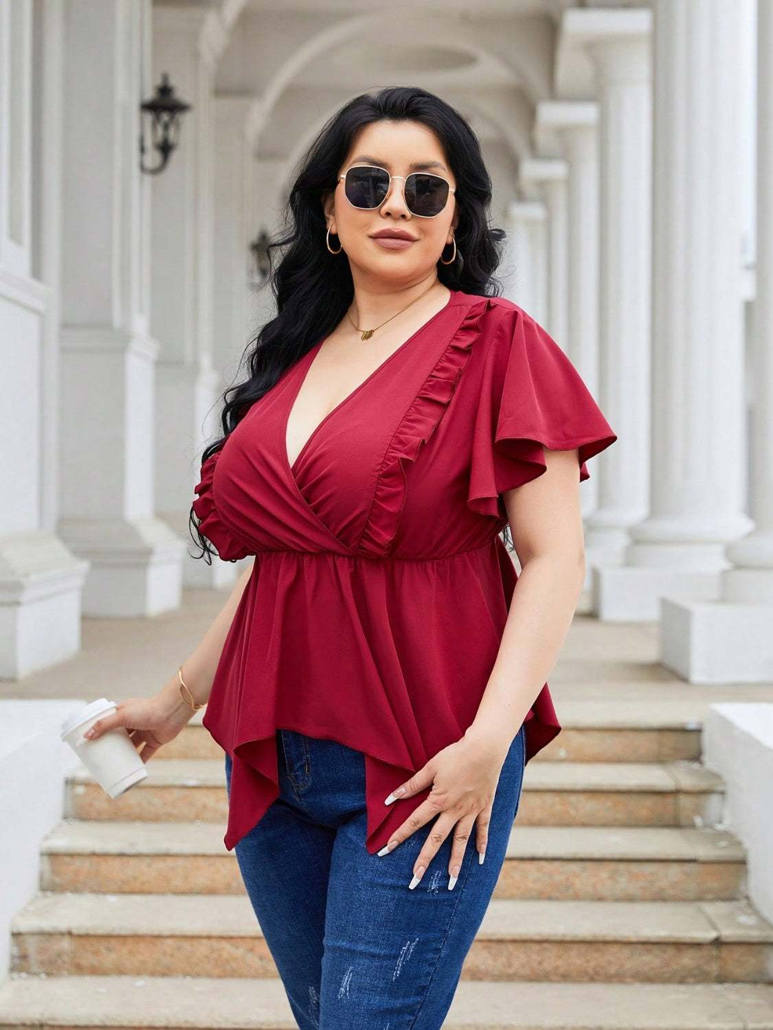 Plus size frill surplice flutter sleeve blouse in red, slightly stretchy polyester.