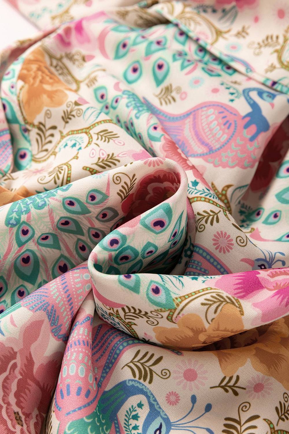 Printed notched lantern sleeve dress fabric with colorful peacock design.