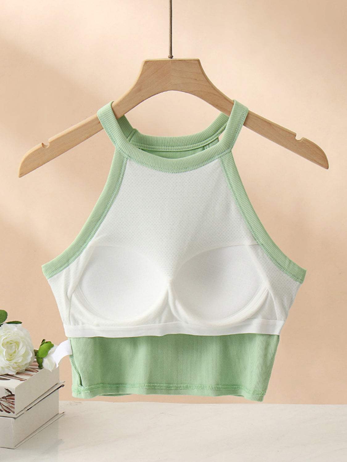 Ribbed Grecian Neck Cropped Tank with Chest Pads in green and white on hanger.