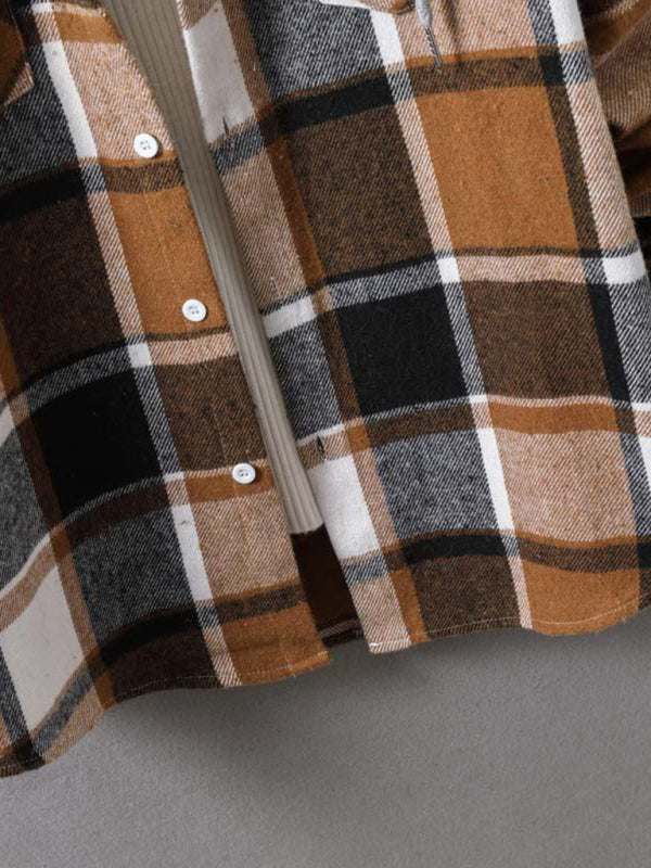Close-up of a men's plaid hooded flannel jacket fabric in brown, black, and white tones.