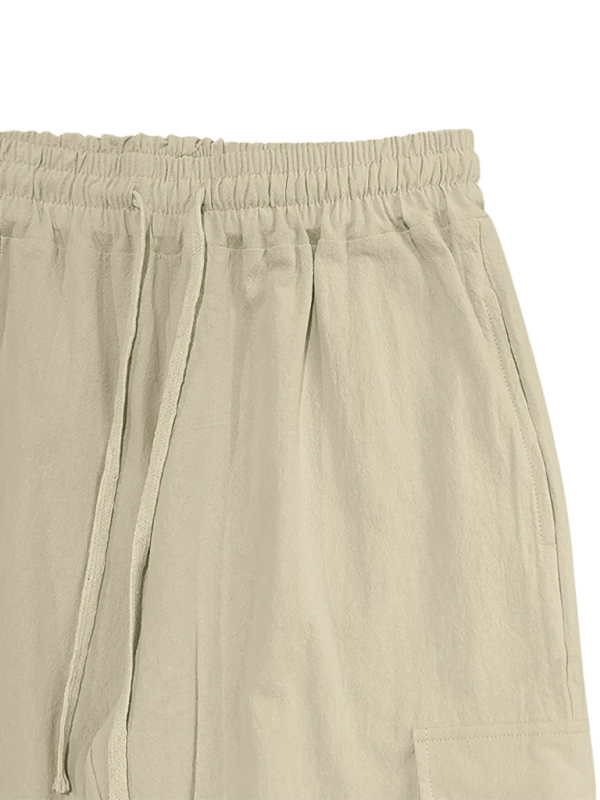 Casual cuffed multi-pocket drawstring trousers in beige cotton fabric.
