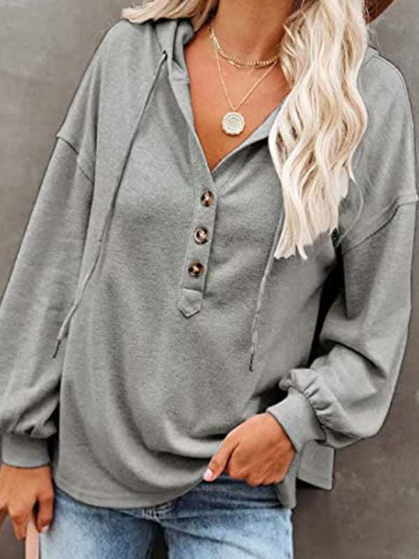 Women's casual loose cardigan hoodie sweatshirt in solid color with drop shoulder lantern sleeves and button placket.