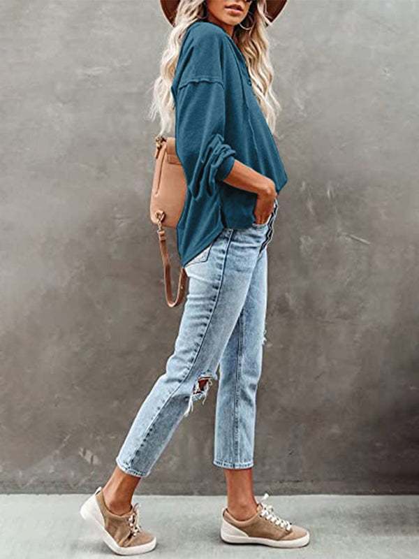 Women's casual loose solid color cardigan hoodie sweatshirt with jeans and sneakers.