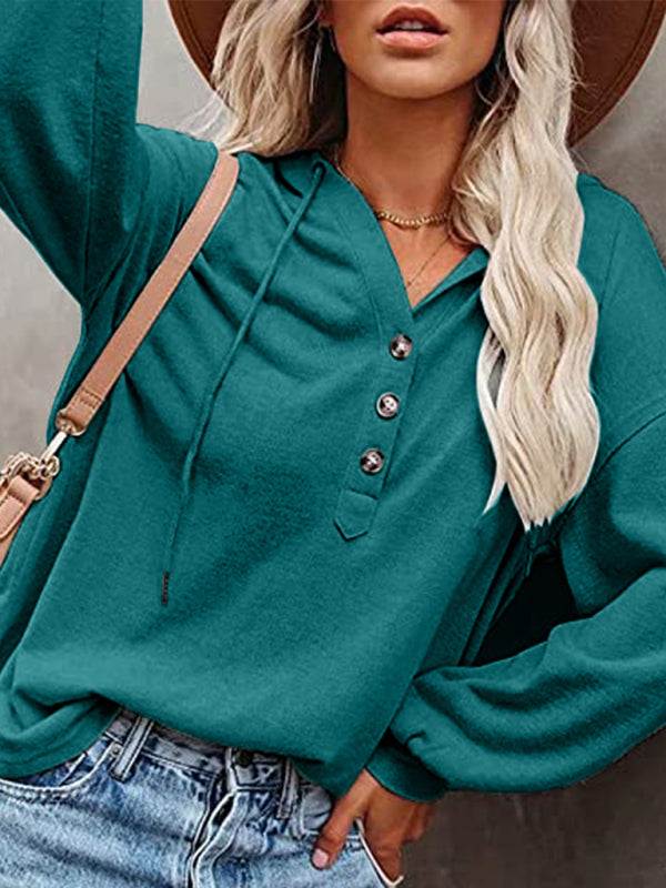 Women's cardigan hoodie in a casual loose style with solid color fabric.