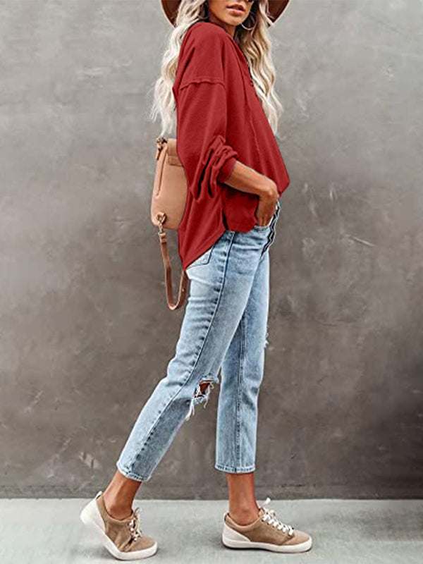 Women's casual loose solid color cardigan hoodie with jeans and sneakers.