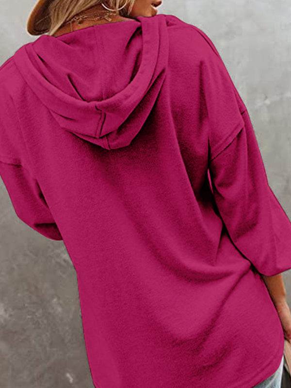 Women's casual loose solid color cardigan hoodie sweatshirt in vibrant pink.