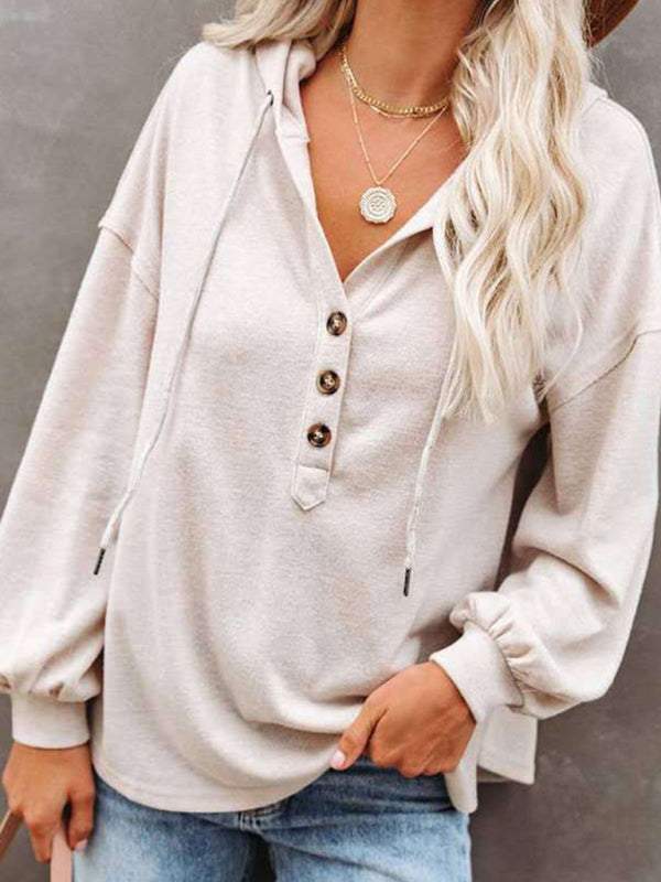 Women's cardigan hoodie with loose fit, solid color, V-neck, and button placket.