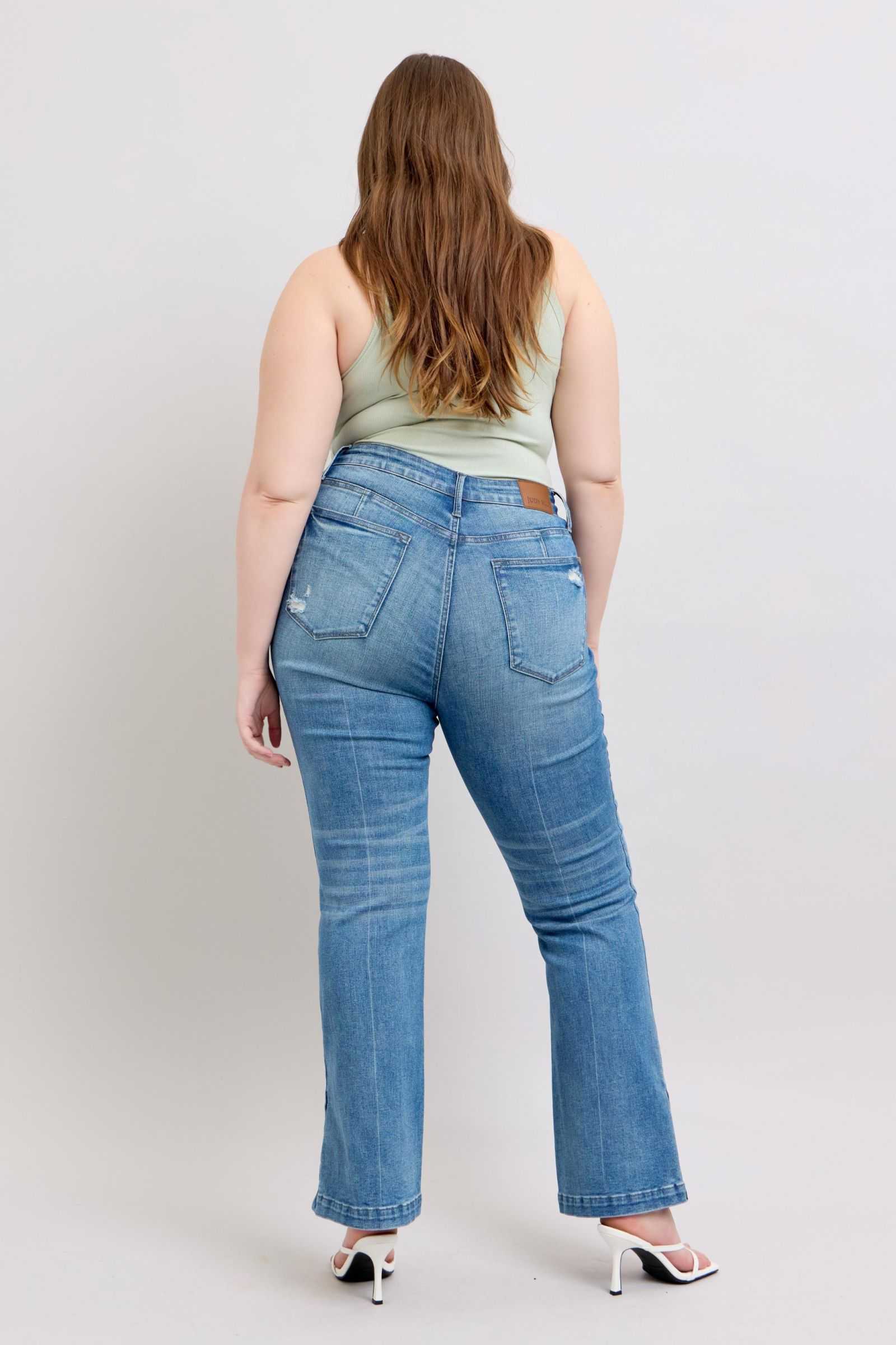 Judy Blue HW tummy control vintage wash slim bootcut jeans with side slit.