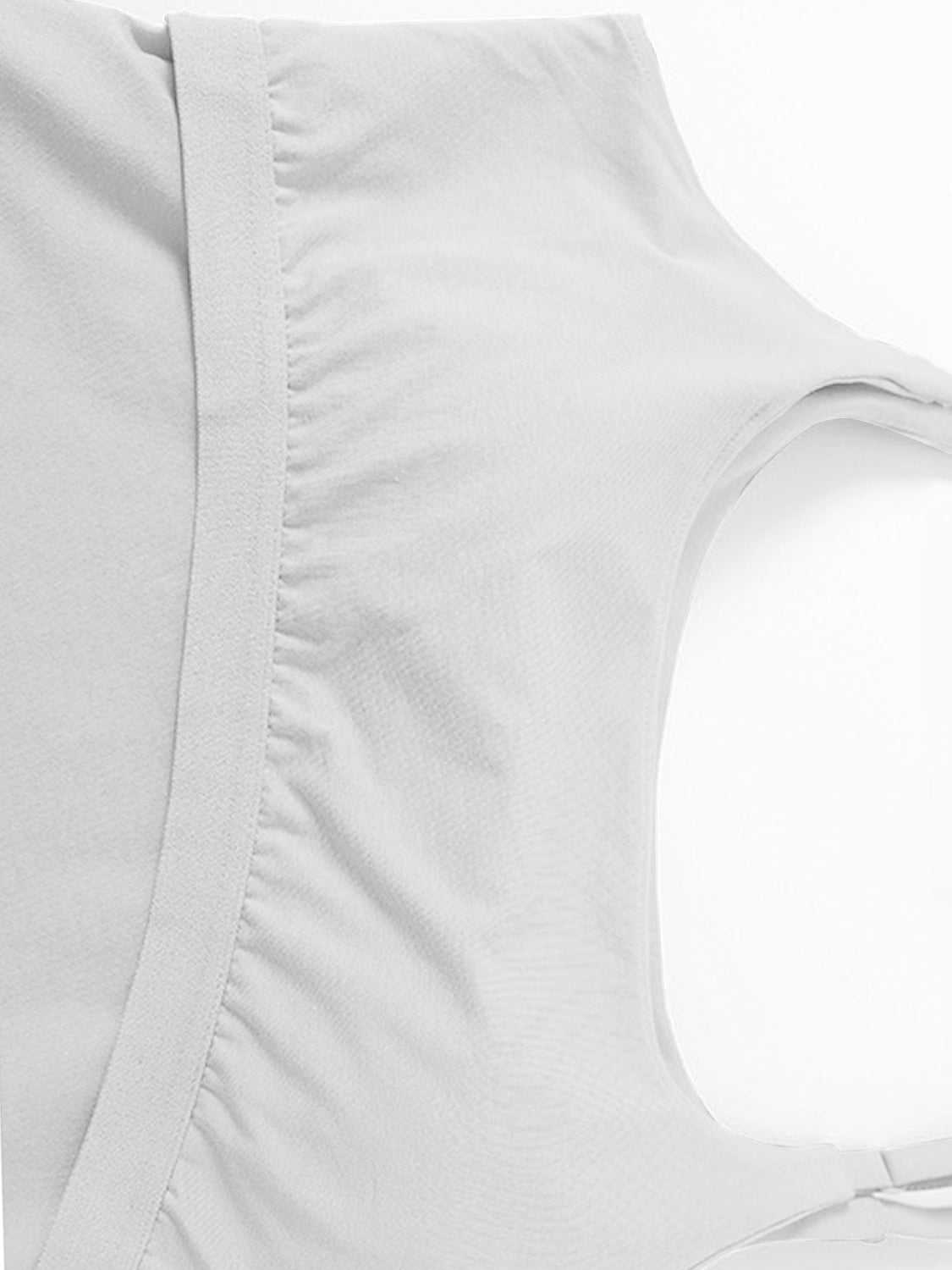 Scoop neck cropped cami with chest pads in light gray fabric.