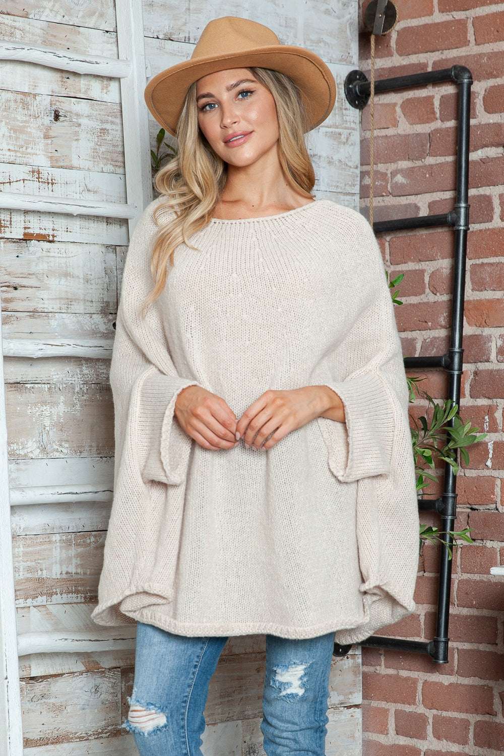 Round Neck Batwing Sleeve Sweater in beige, featuring a loose fit and slightly stretchy polyester fabric.