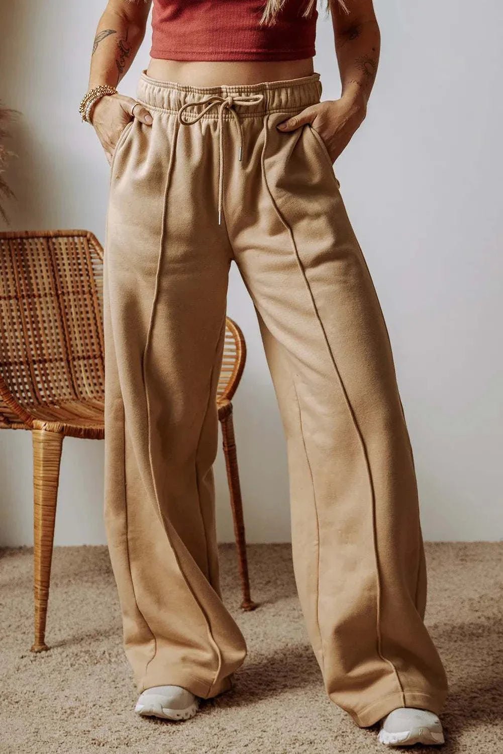 Drawstring wide leg pants with pockets, polyester-cotton blend, shown in beige.