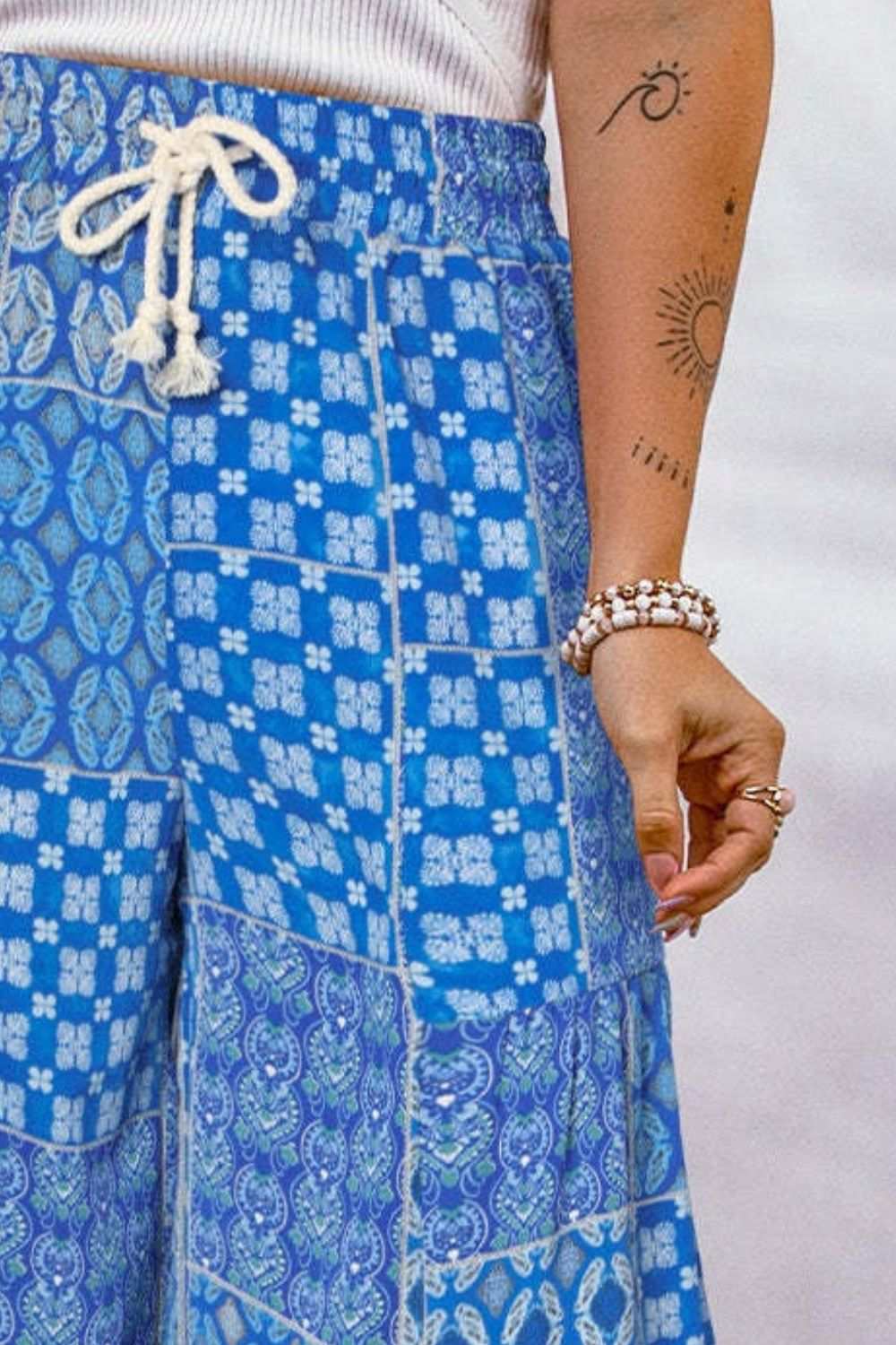 Full size drawstring printed wide leg pants in blue pattern.