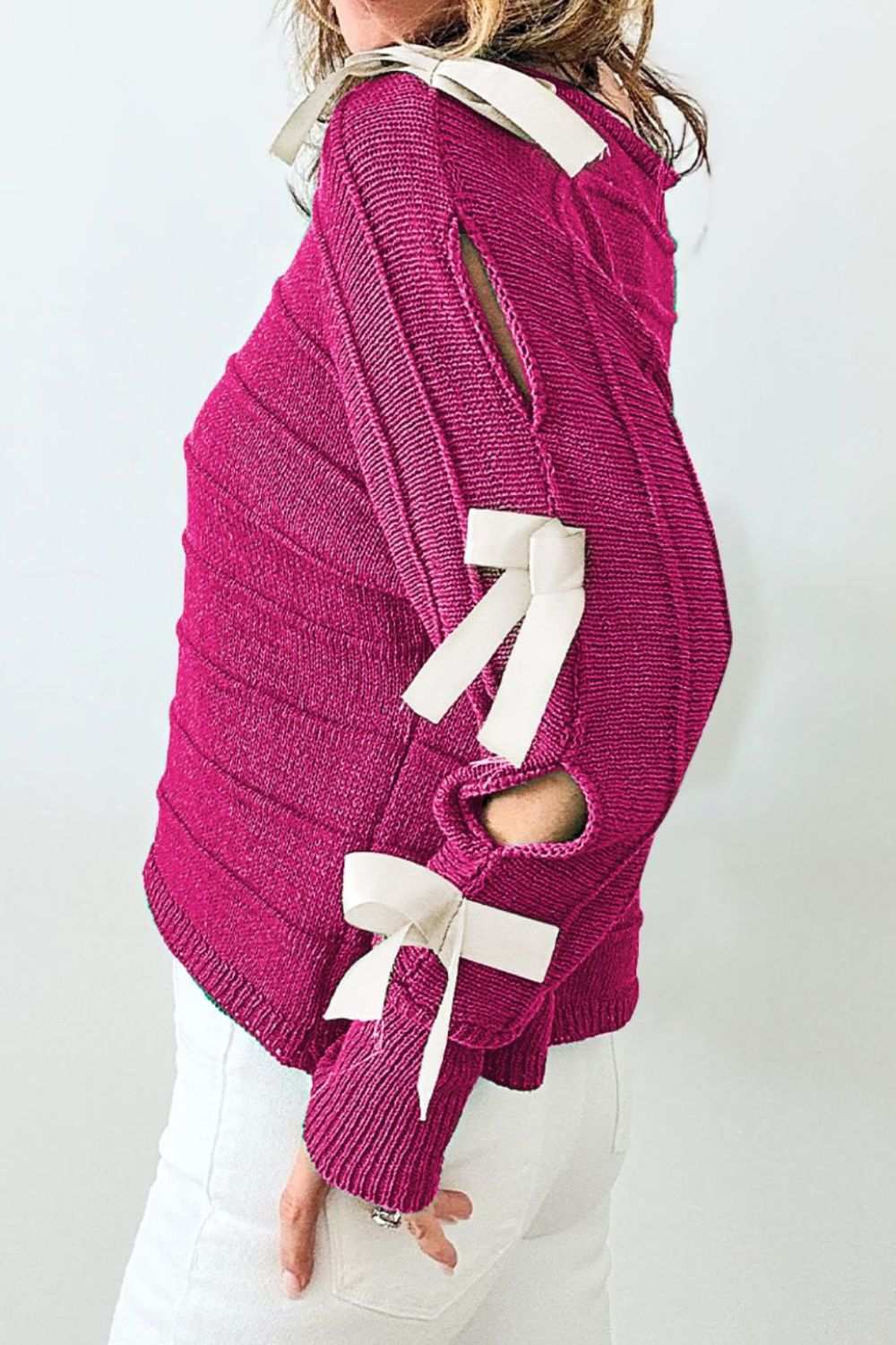 Bow cutout round neck long sleeve knit top in dark pink with tied details.