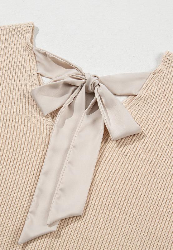 Tied back V-neck long sleeve sweater with bow detail.