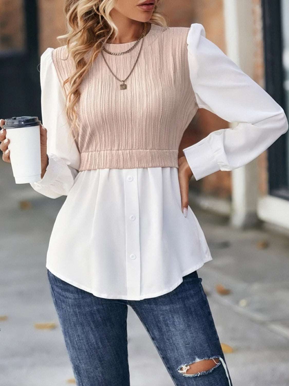 Contrast round neck puff sleeve blouse with beige textured bodice and white button-down sleeves, styled with jeans.