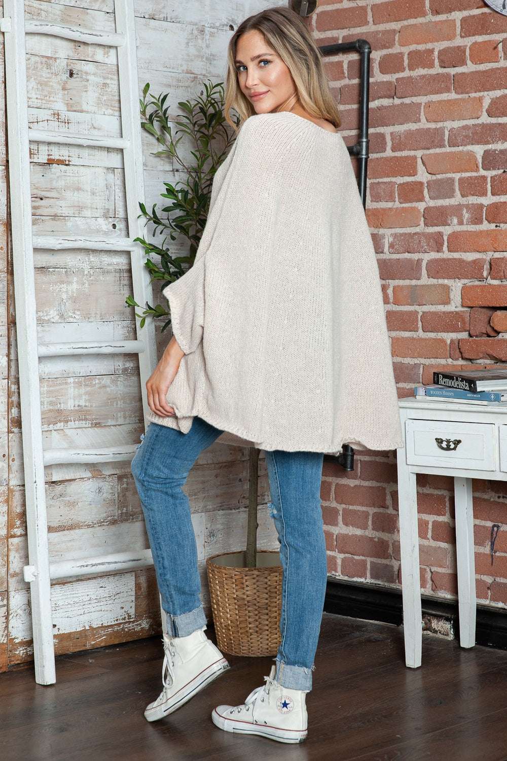 Round neck batwing sleeve sweater in cream, slightly stretchy, 100% polyester.