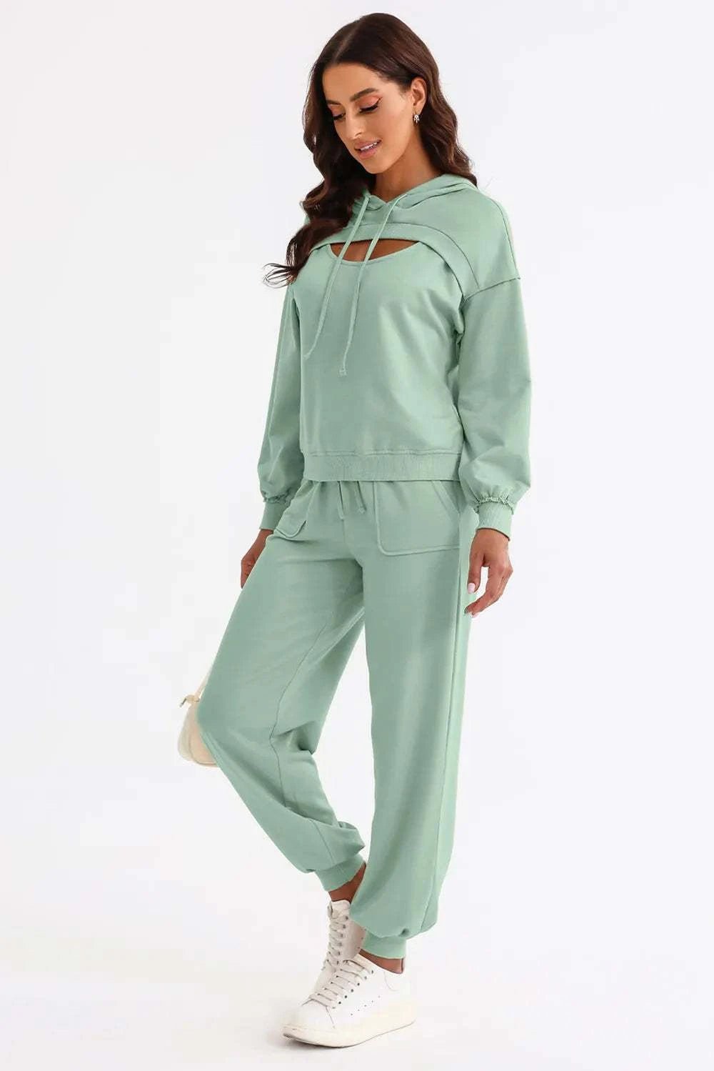 Cutout drawstring hoodie and joggers active set in mint green.