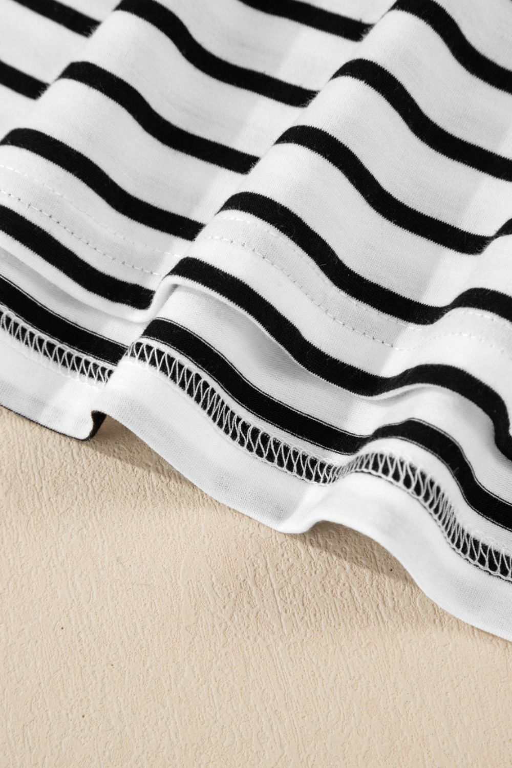 Stripe Half Sleeve Scoop Neck Top with black and white pattern, slightly stretchy material.