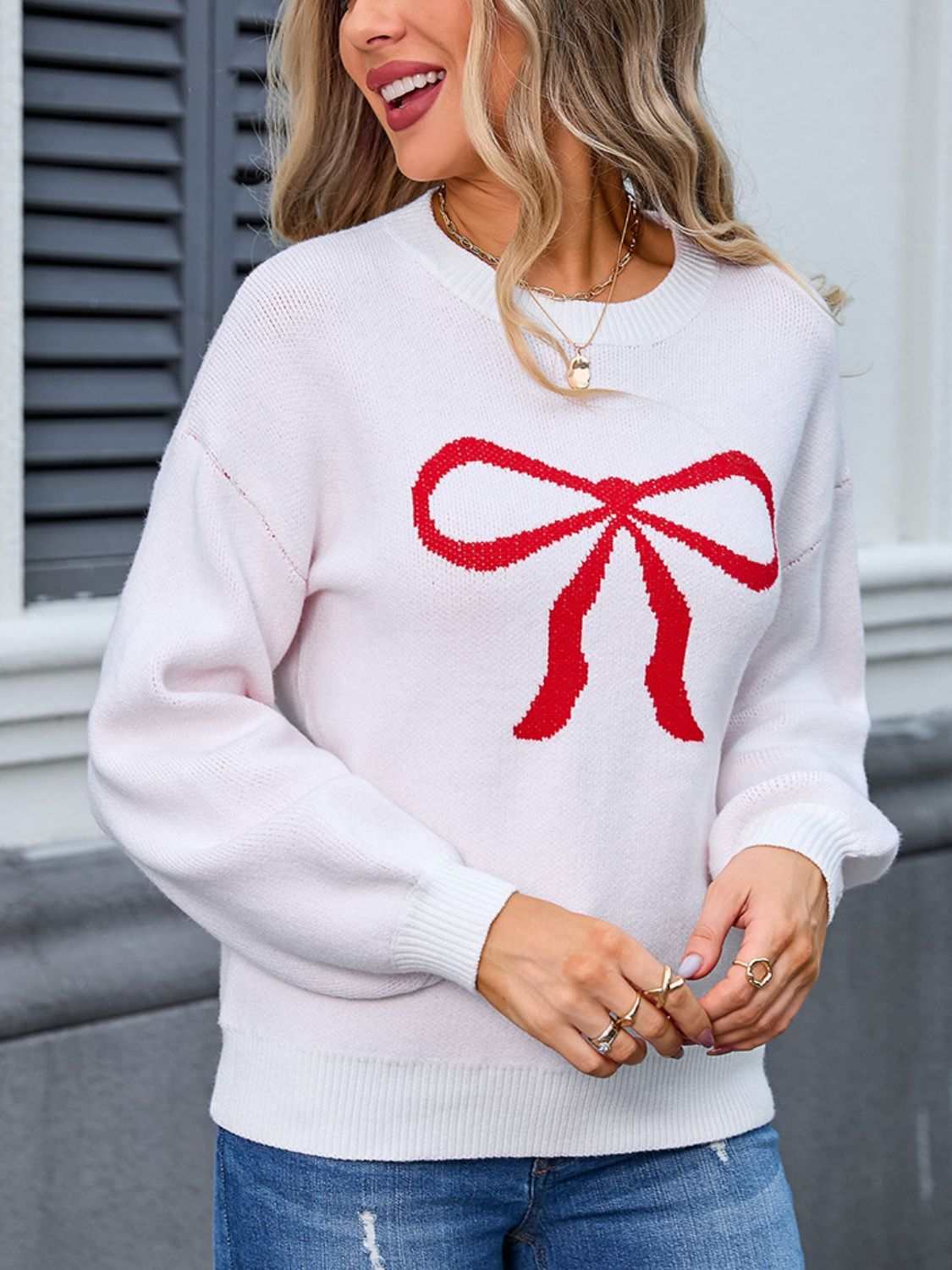 Angel Wings Bow Graphic Round Neck Long Sleeve Sweater in white with red bow design, moderate stretch, acrylic and polyester blend.