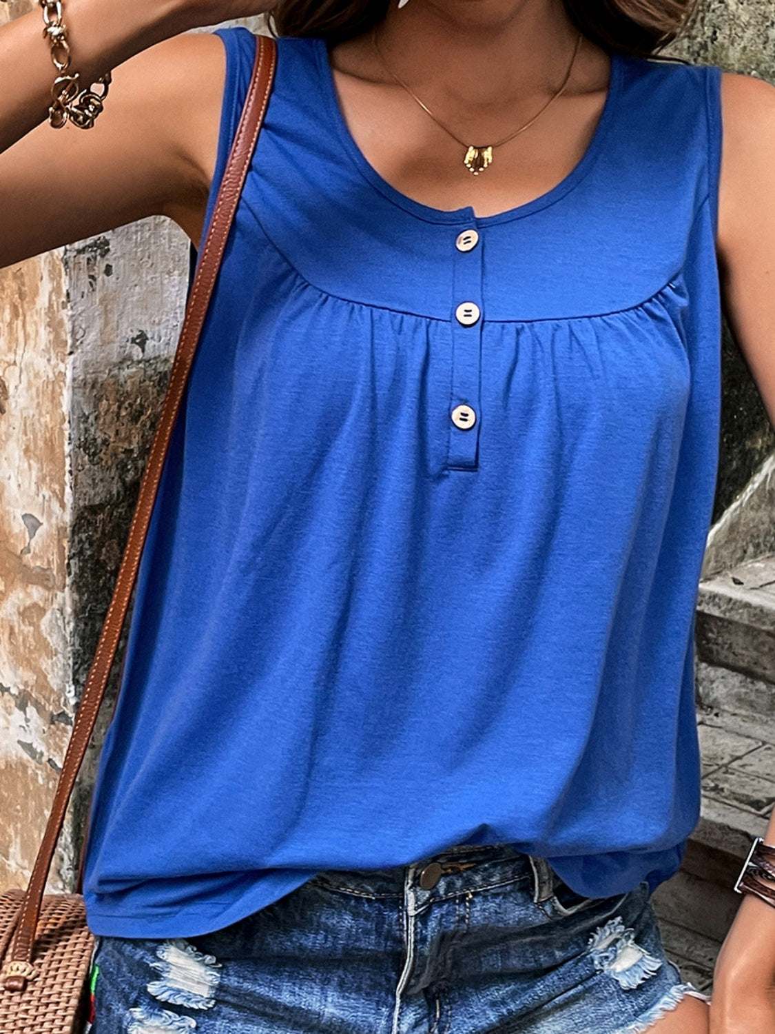 Blue round neck tank top with button detail and ruched design.