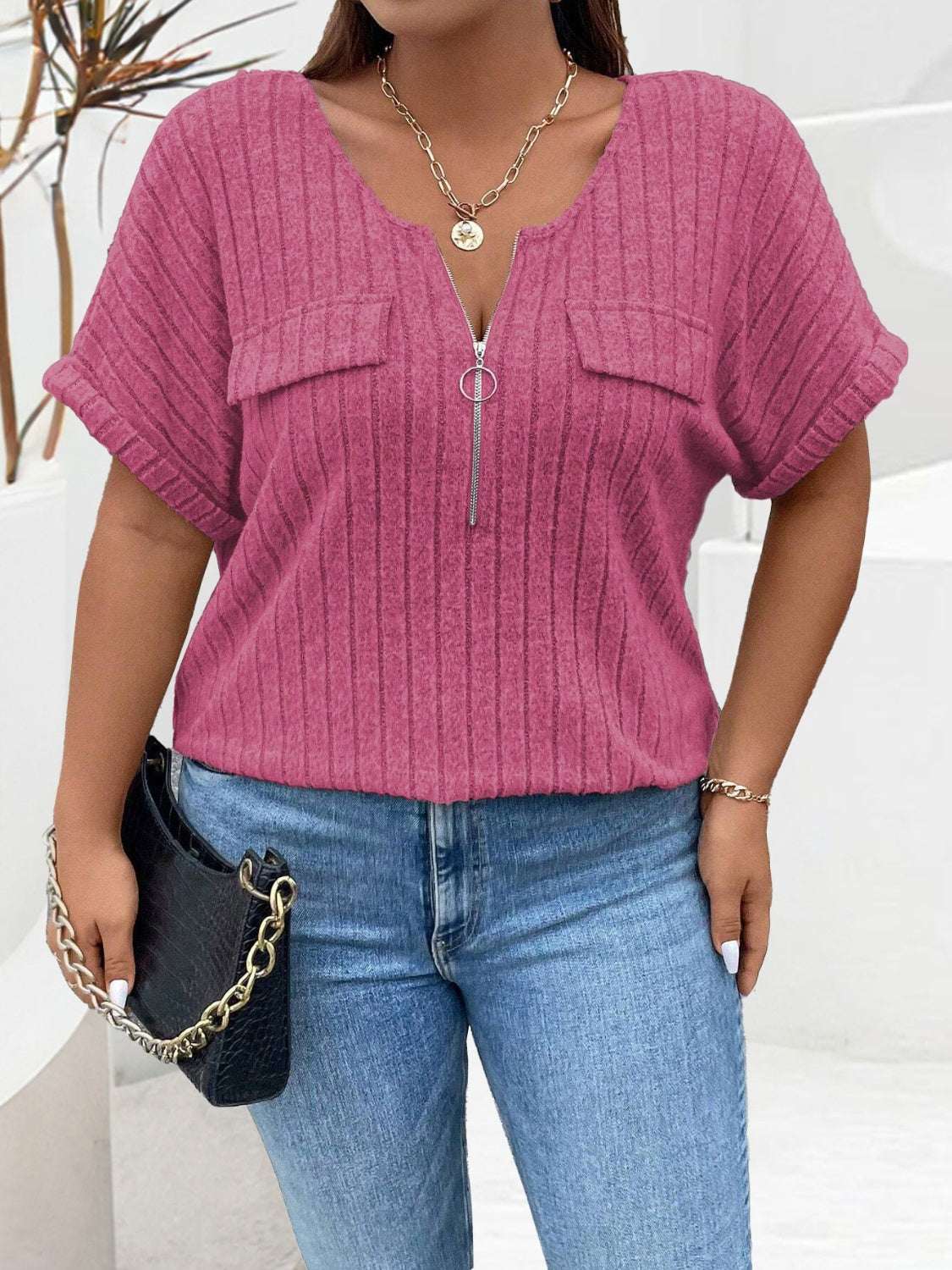Plus size half zip short sleeve T-shirt in pink with ribbed texture.