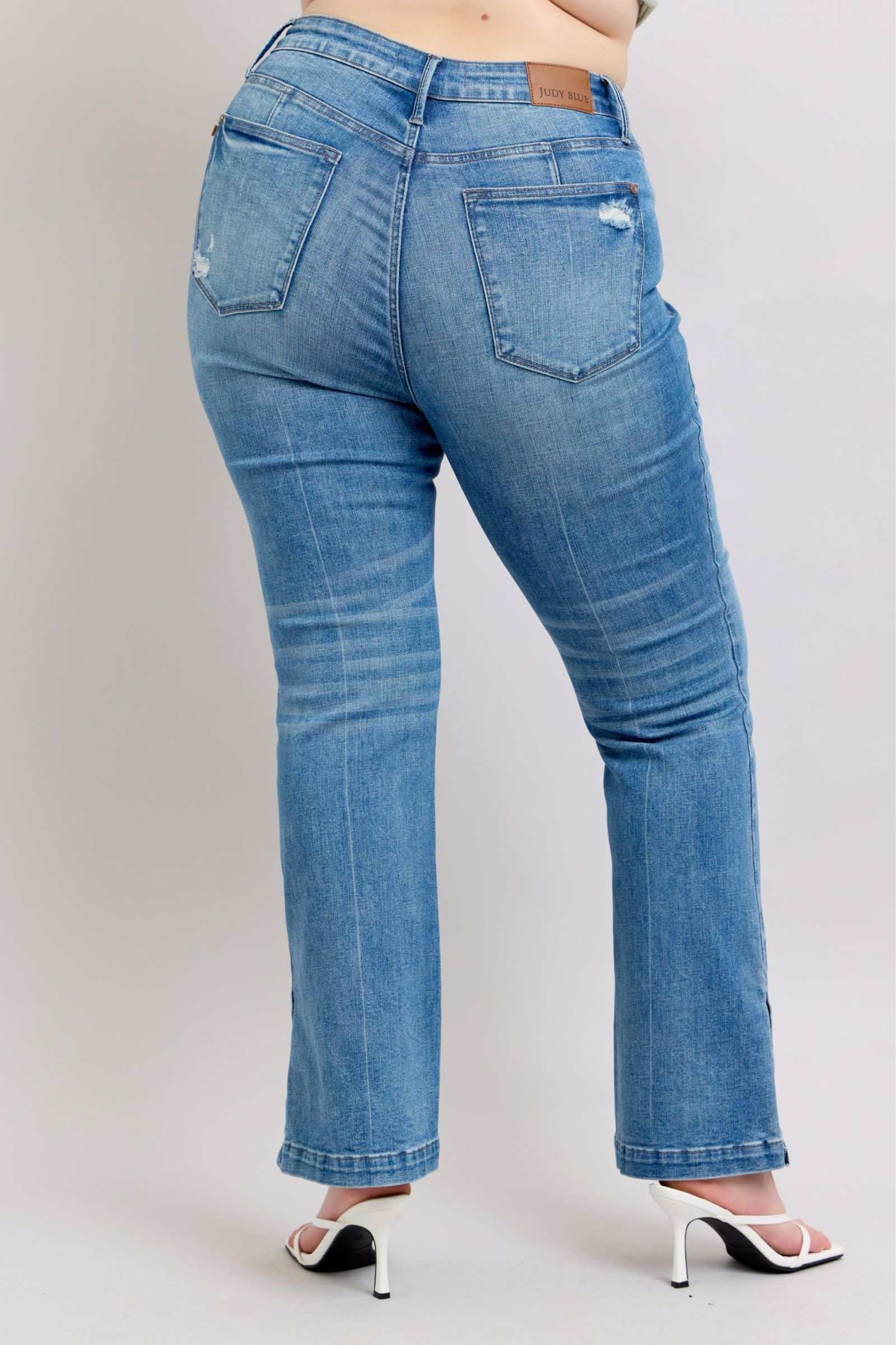 Judy Blue HW tummy control vintage wash slim bootcut jeans with side slit.