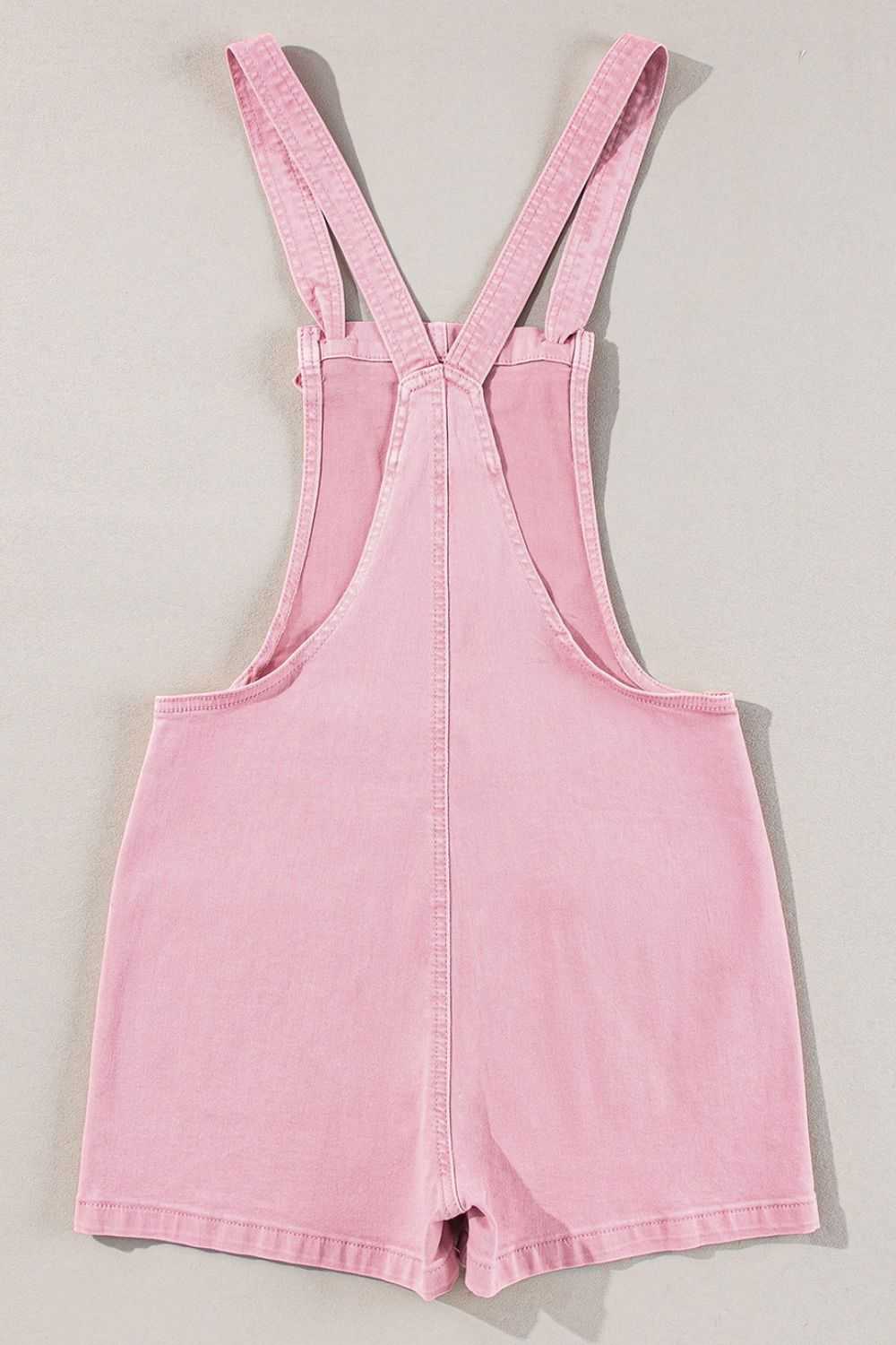 Knot straps denim overalls with pockets in pink.