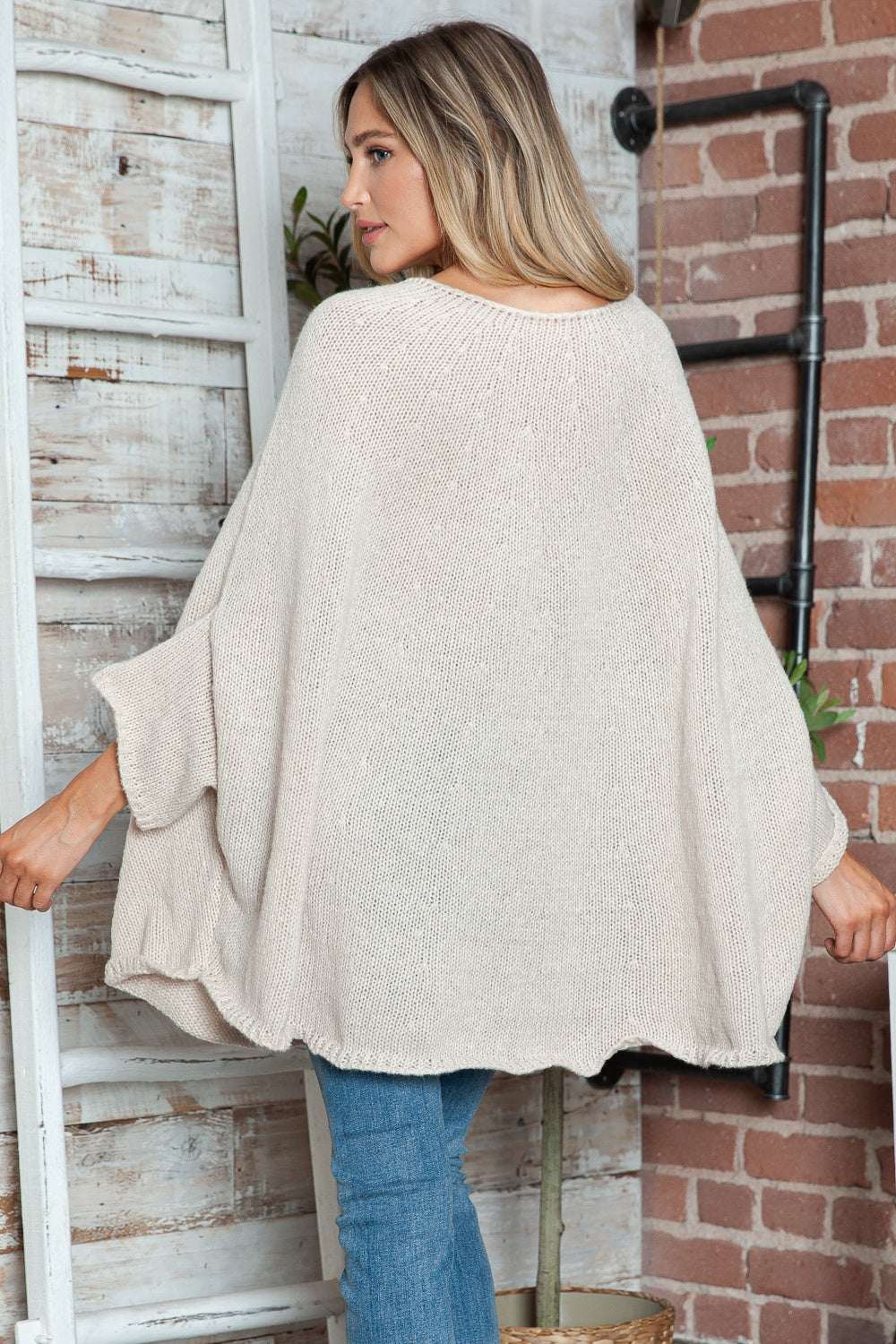 Round neck batwing sleeve sweater in light beige, slightly stretchy polyester fabric.