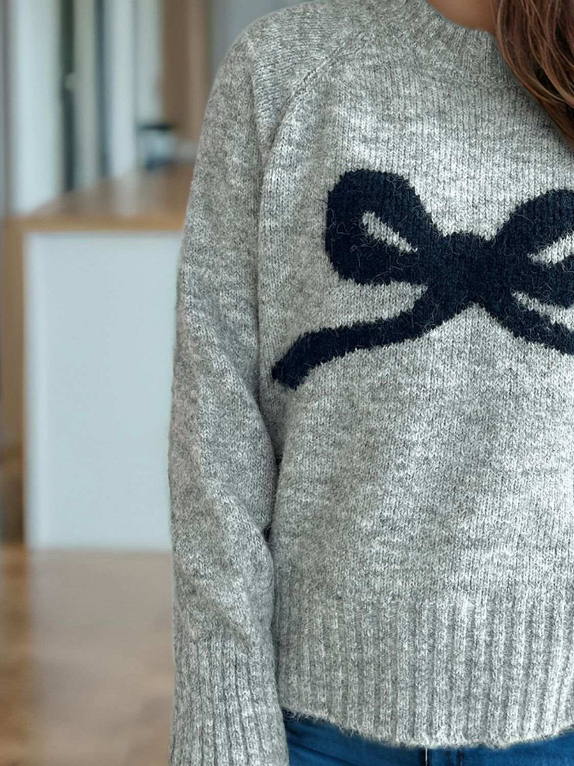 Bow round neck long sleeve sweater with basic style and slightly stretchy fabric.