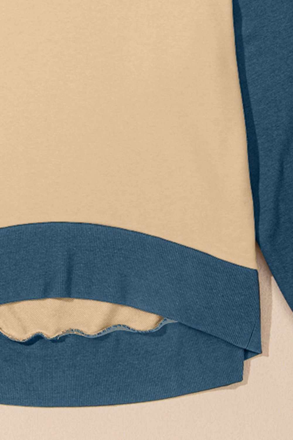 Contrast round neck long sleeve sweatshirt with blue and beige design.