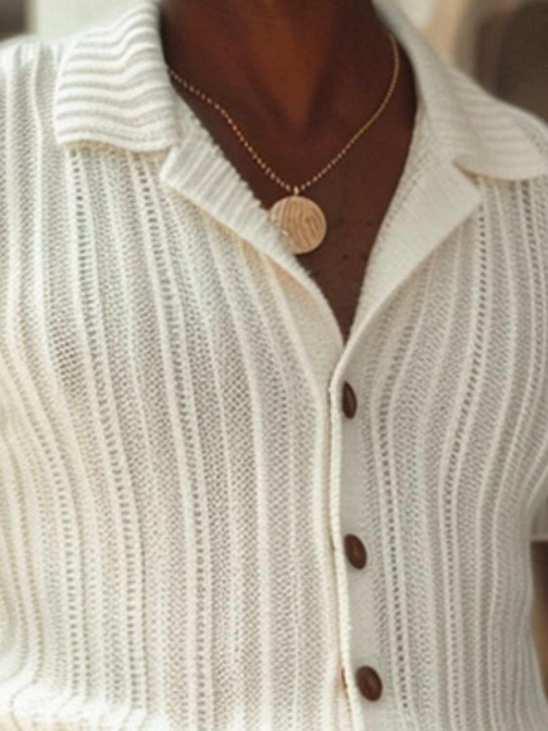 Men's plus size button-down short sleeve top with wooden buttons and textured fabric.