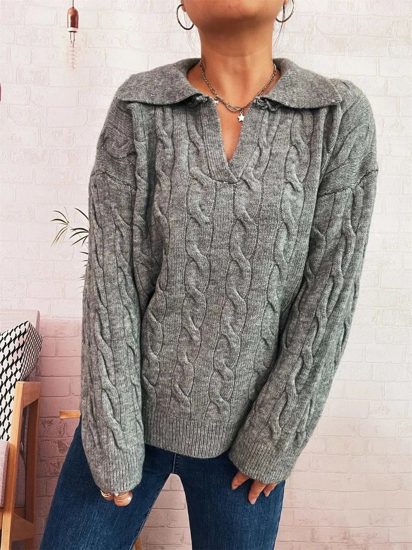 Gray cable knit Johnny collar sweater with V-neck and long sleeves, made of 100% polyester, slightly stretchy.