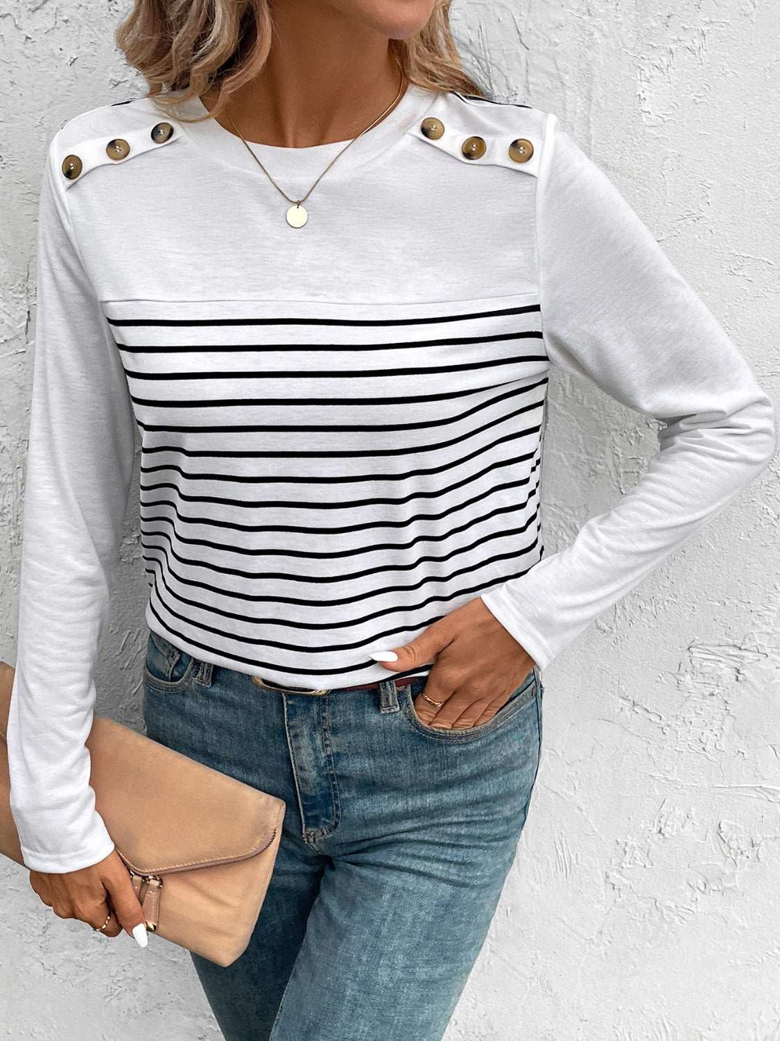 Decorative button striped round neck long sleeve T-shirt with jeans.