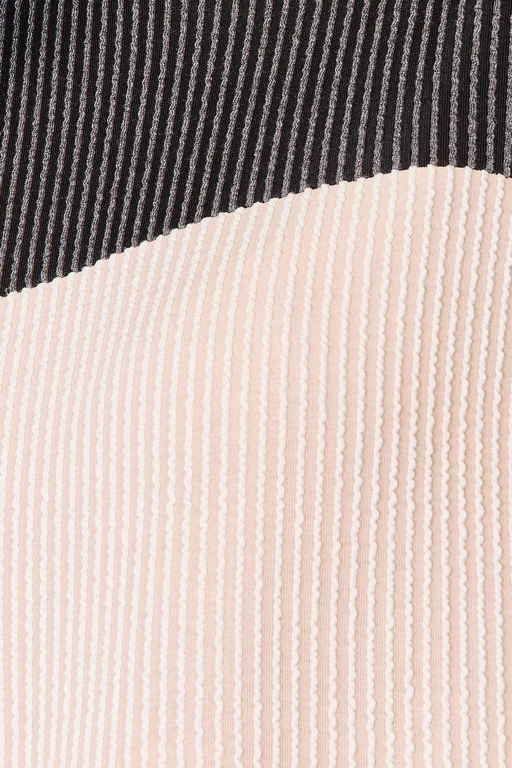 Close-up of color-block design on a dropped shoulder t-shirt.