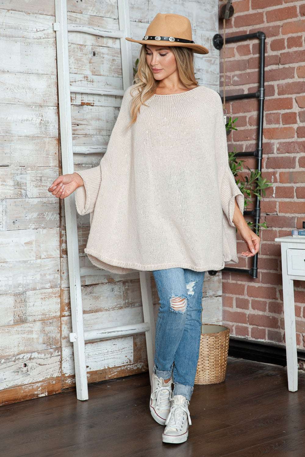 Round neck batwing sleeve sweater, slightly stretchy, 100% polyester, casual style.