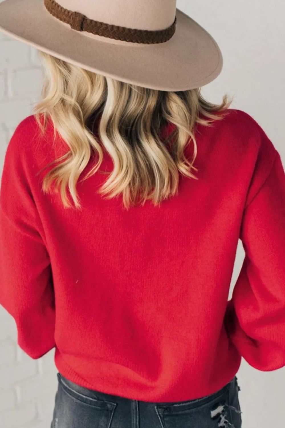 Letter pearl detail round neck long sleeve sweater in red, back view.