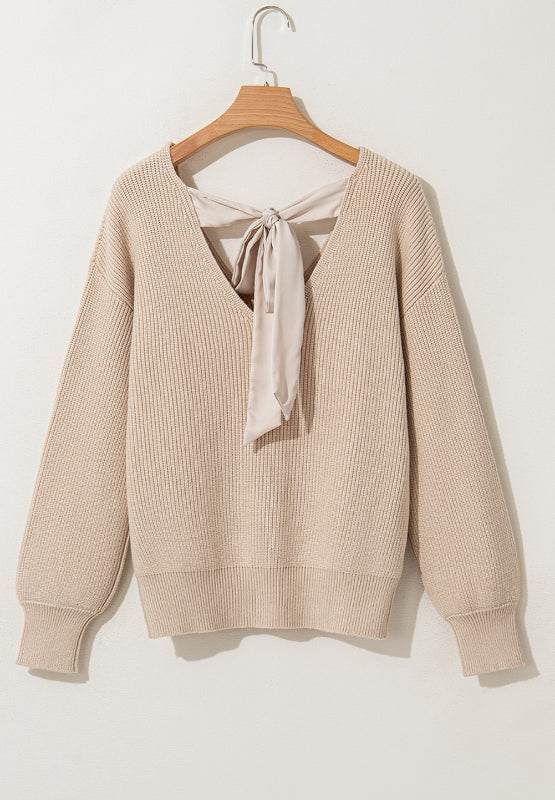 Tied back V-neck long sleeve sweater with bow in beige.